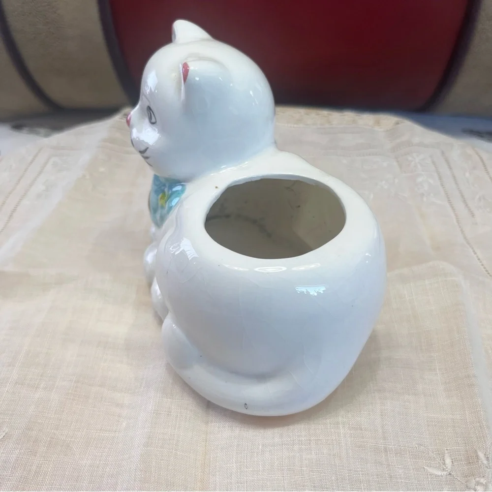 White Ceramic Cat-Shaped Planter with a Blue Scarf Adorned with Fish.